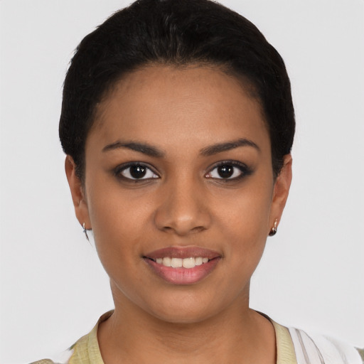 Joyful black young-adult female with short  brown hair and brown eyes