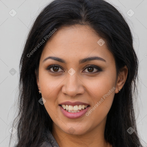 Joyful latino young-adult female with long  brown hair and brown eyes