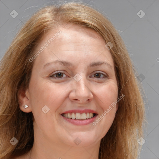 Joyful white adult female with medium  brown hair and brown eyes