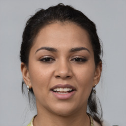 Joyful white young-adult female with medium  brown hair and brown eyes