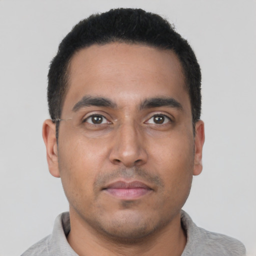 Neutral latino young-adult male with short  black hair and brown eyes