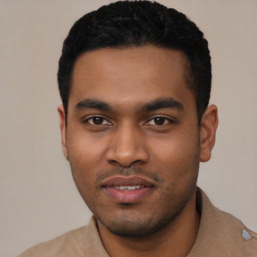 Joyful latino young-adult male with short  black hair and brown eyes
