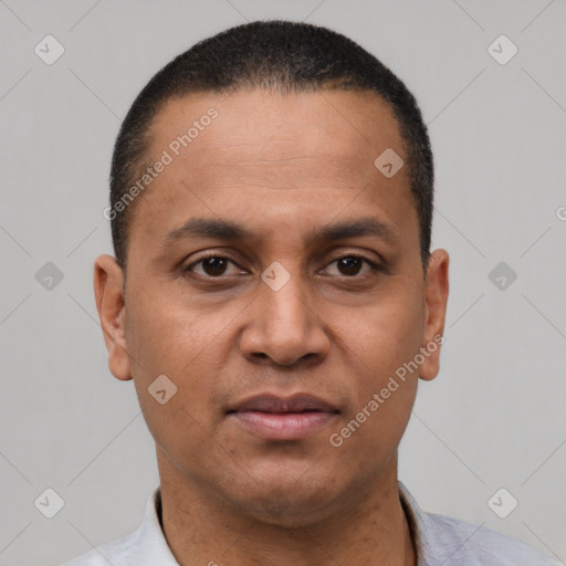 Neutral latino adult male with short  black hair and brown eyes