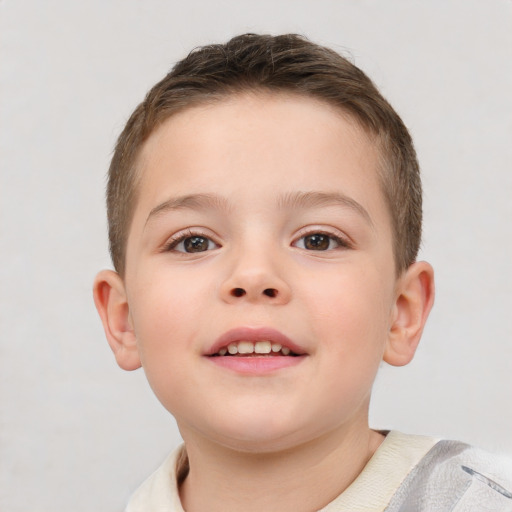 Joyful white child male with short  brown hair and brown eyes