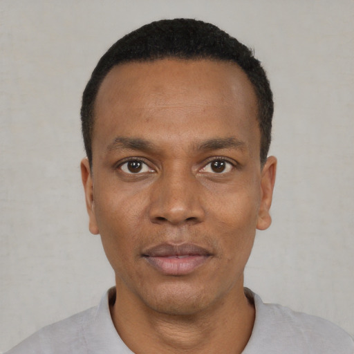 Neutral black adult male with short  black hair and brown eyes