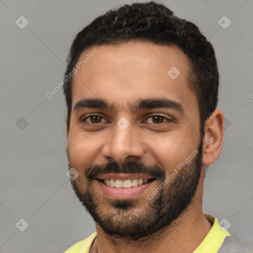 Joyful latino young-adult male with short  black hair and brown eyes