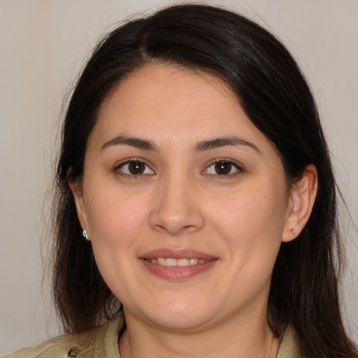 Joyful white young-adult female with medium  brown hair and brown eyes