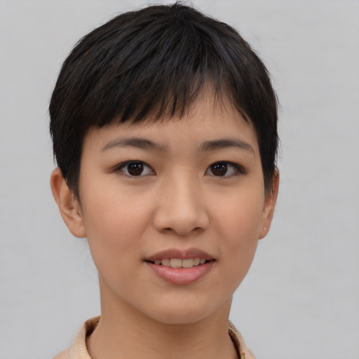 Joyful asian young-adult female with short  brown hair and brown eyes