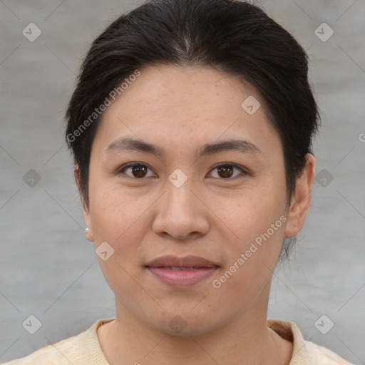 Joyful asian young-adult female with short  brown hair and brown eyes