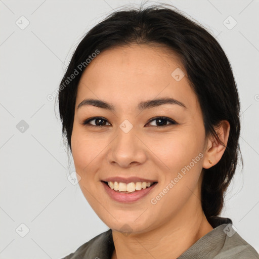 Joyful asian young-adult female with medium  brown hair and brown eyes