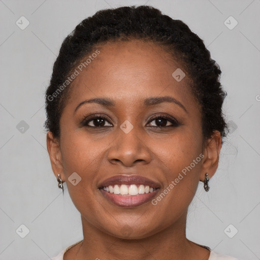 Joyful black young-adult female with short  brown hair and brown eyes