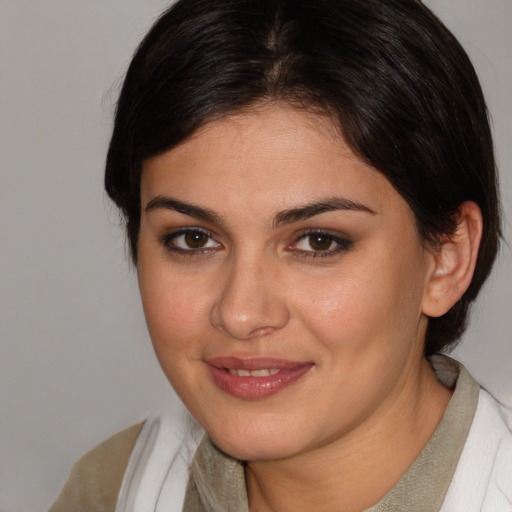 Joyful white young-adult female with medium  brown hair and brown eyes