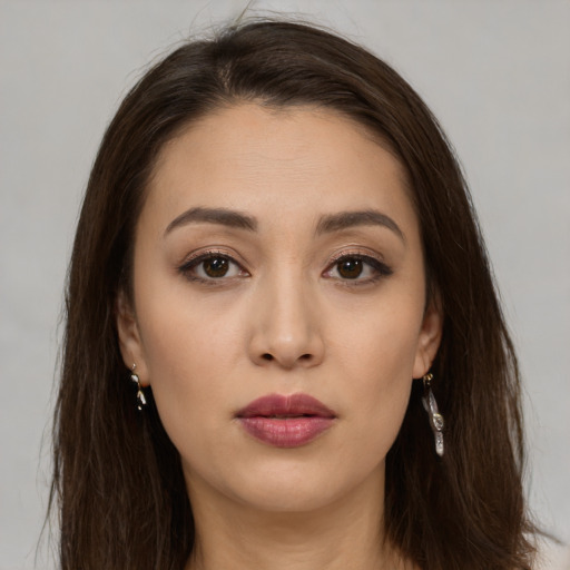 Neutral white young-adult female with long  brown hair and brown eyes
