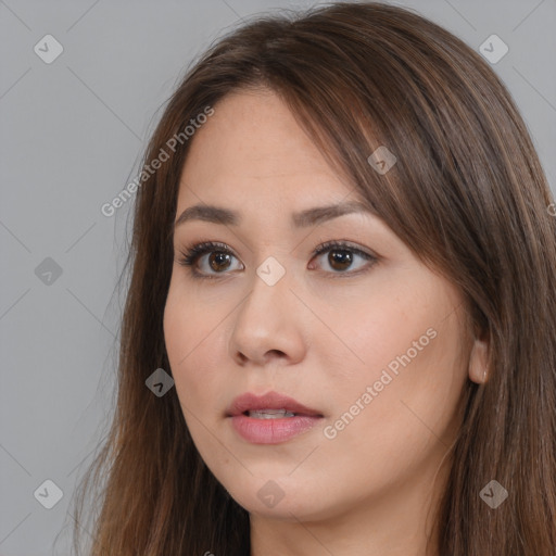 Neutral white young-adult female with long  brown hair and brown eyes