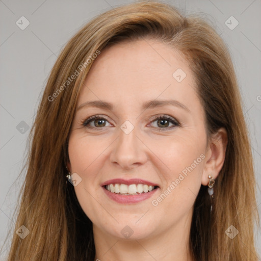 Joyful white adult female with long  brown hair and brown eyes