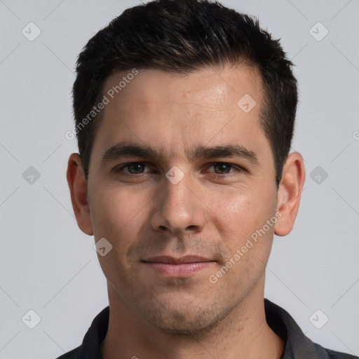 Joyful white young-adult male with short  black hair and brown eyes