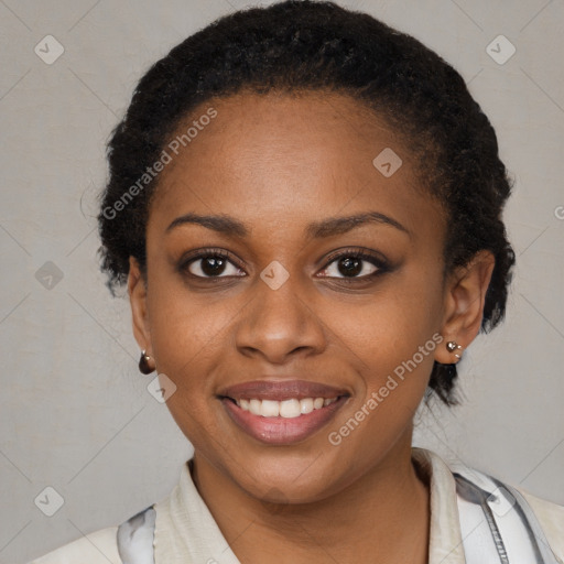 Joyful black young-adult female with short  brown hair and brown eyes