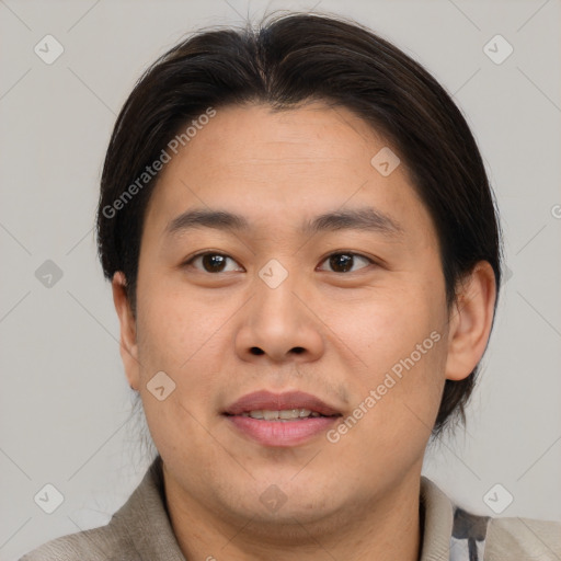 Joyful asian young-adult male with short  brown hair and brown eyes