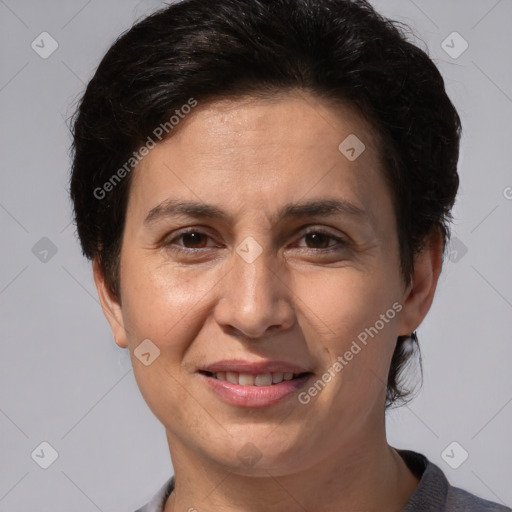 Joyful white adult female with short  brown hair and brown eyes