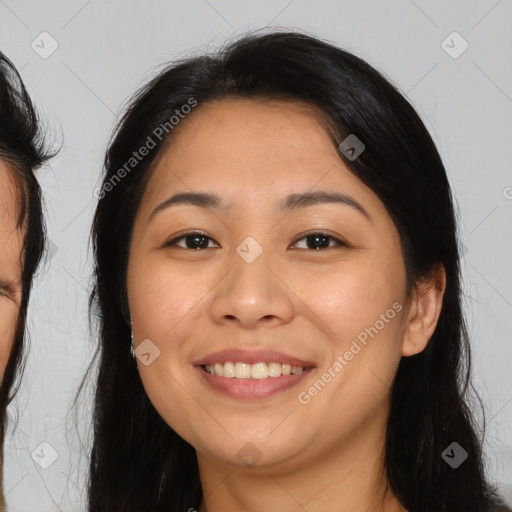 Joyful asian young-adult female with long  brown hair and brown eyes