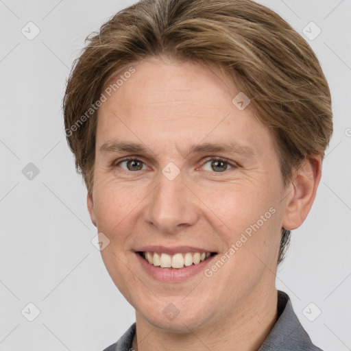 Joyful white adult female with short  brown hair and grey eyes