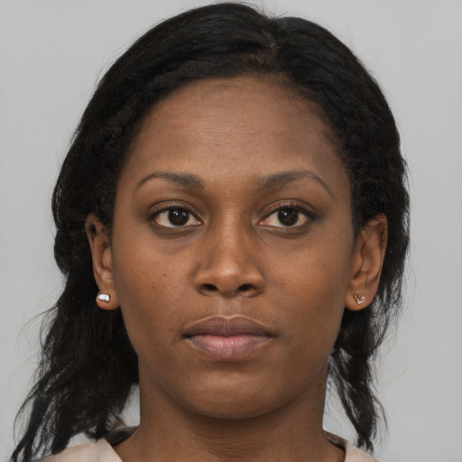 Neutral black young-adult female with long  brown hair and brown eyes