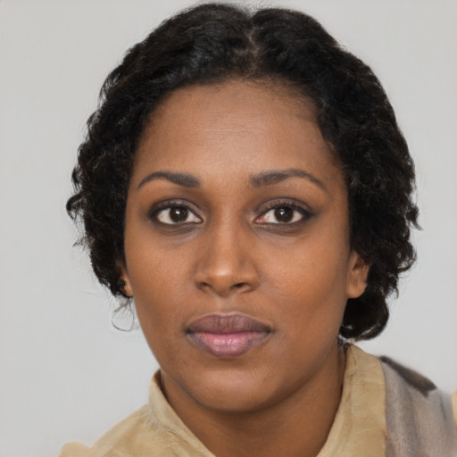 Neutral black young-adult female with short  brown hair and brown eyes