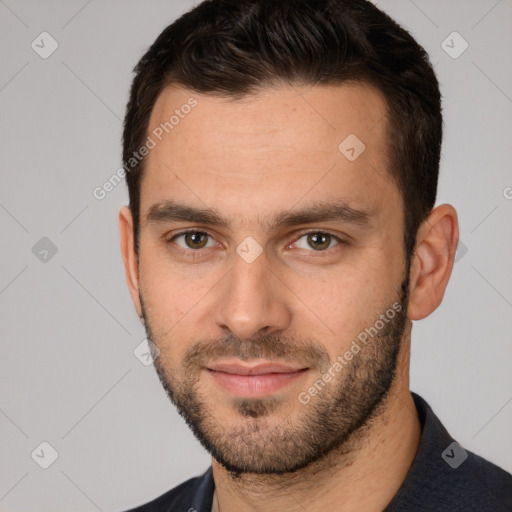 Joyful white young-adult male with short  brown hair and brown eyes