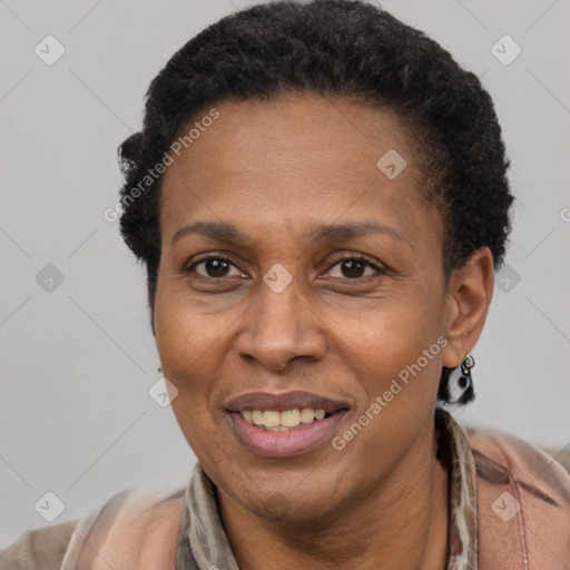 Joyful latino adult female with short  brown hair and brown eyes