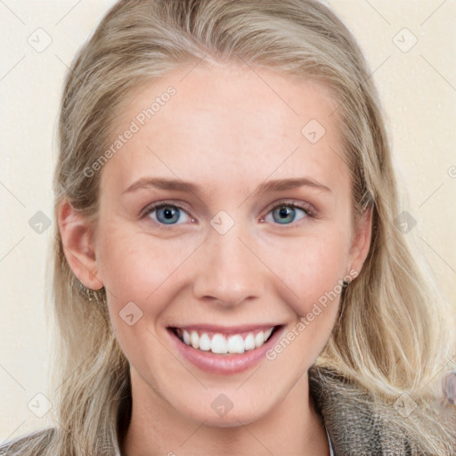 Joyful white young-adult female with long  brown hair and blue eyes