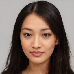 Joyful asian young-adult female with long  brown hair and brown eyes