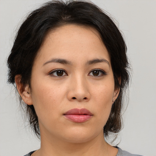 Neutral asian young-adult female with medium  brown hair and brown eyes