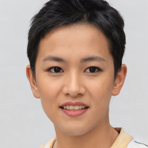 Joyful asian young-adult female with short  brown hair and brown eyes