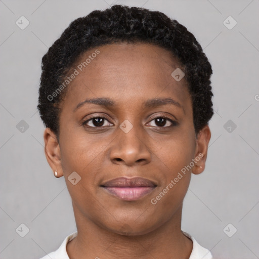 Joyful black young-adult female with short  brown hair and brown eyes