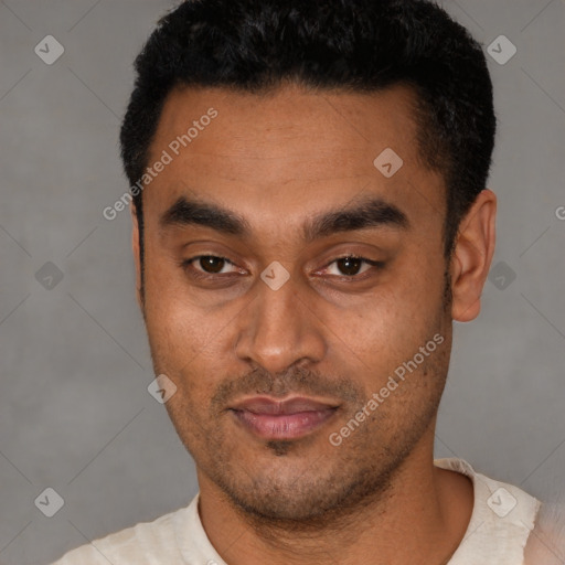 Joyful latino young-adult male with short  black hair and brown eyes