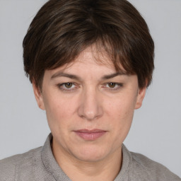 Joyful white adult female with short  brown hair and grey eyes