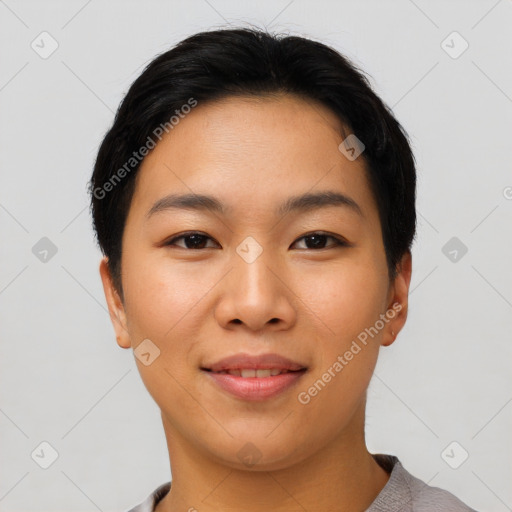 Joyful asian young-adult female with short  brown hair and brown eyes