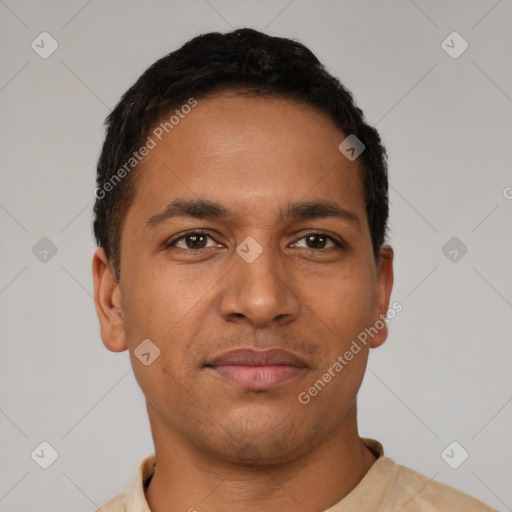 Joyful latino young-adult male with short  black hair and brown eyes