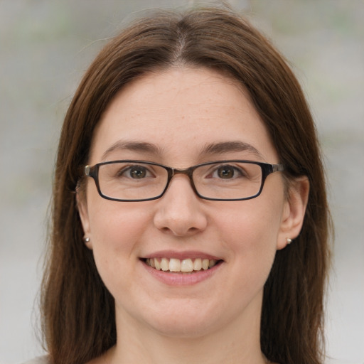 Joyful white young-adult female with medium  brown hair and blue eyes