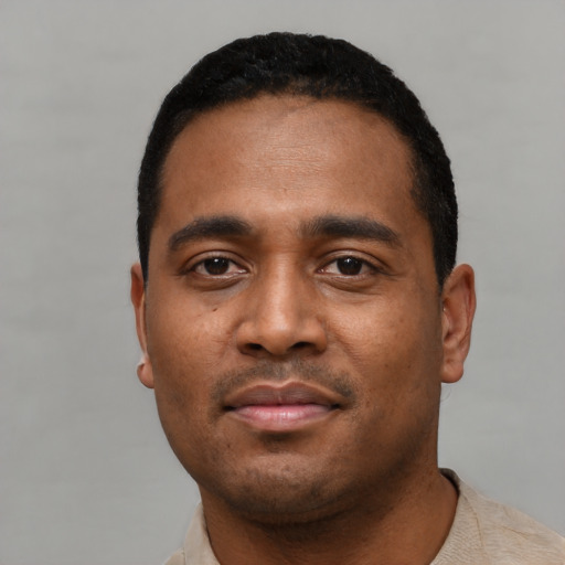 Neutral black young-adult male with short  black hair and brown eyes
