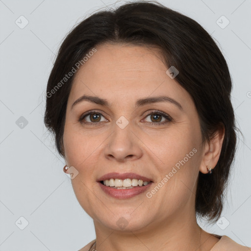 Joyful white adult female with medium  brown hair and brown eyes