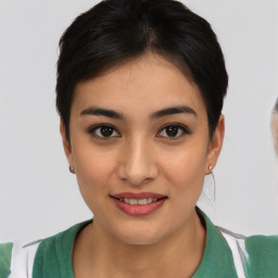 Joyful asian young-adult female with short  brown hair and brown eyes