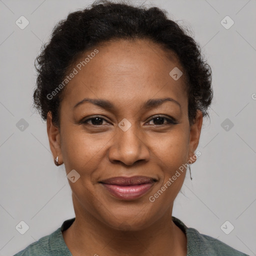 Joyful black adult female with short  brown hair and brown eyes