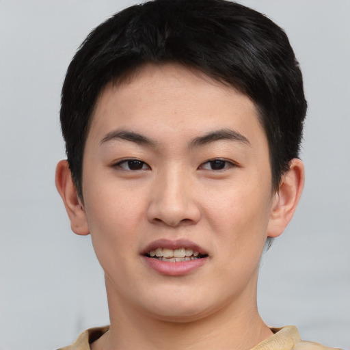 Joyful asian young-adult female with short  black hair and brown eyes