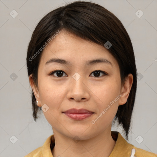 Joyful asian young-adult female with medium  brown hair and brown eyes