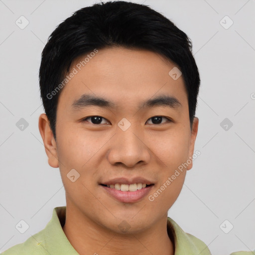 Joyful asian young-adult male with short  black hair and brown eyes