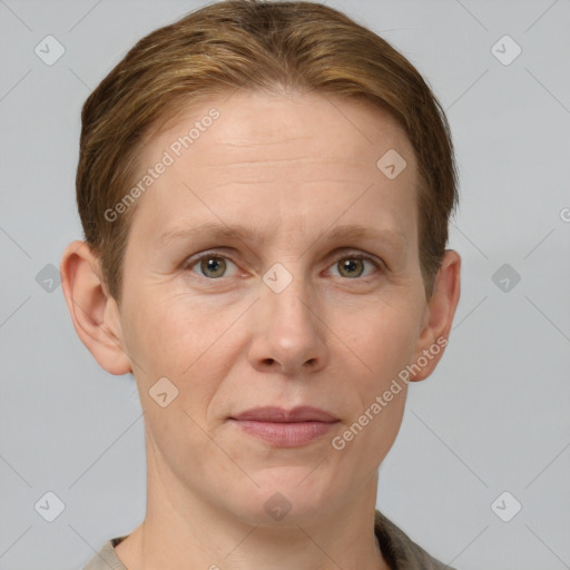 Joyful white adult female with short  brown hair and grey eyes