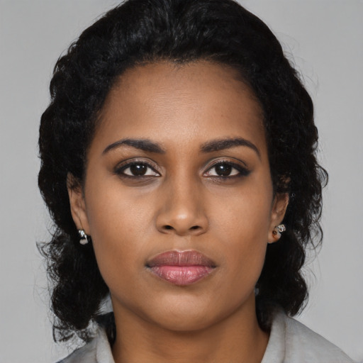 Neutral black young-adult female with medium  black hair and brown eyes