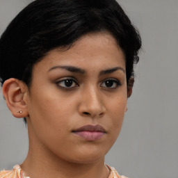 Neutral latino young-adult female with short  brown hair and brown eyes
