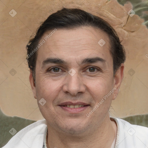 Joyful white adult male with short  brown hair and brown eyes